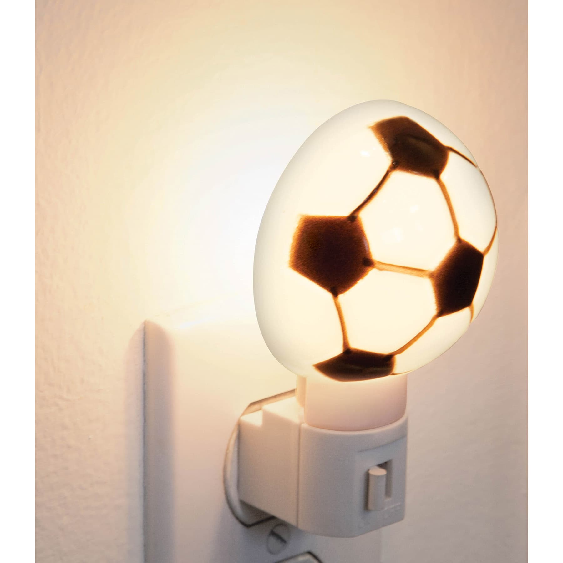 Luz de noche, balón soccer